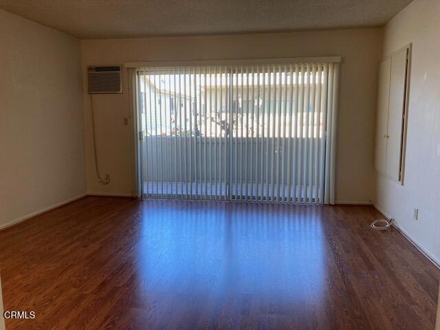 263 Ohio Street, Unit 5 Pasadena, CA 91106 - Photo 2 of 5 an empty room with wooden floor and windows