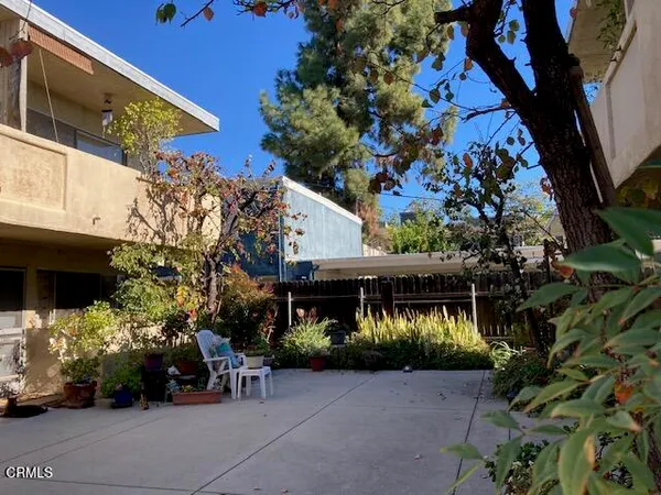 a view of house with a outdoor space and sitting area