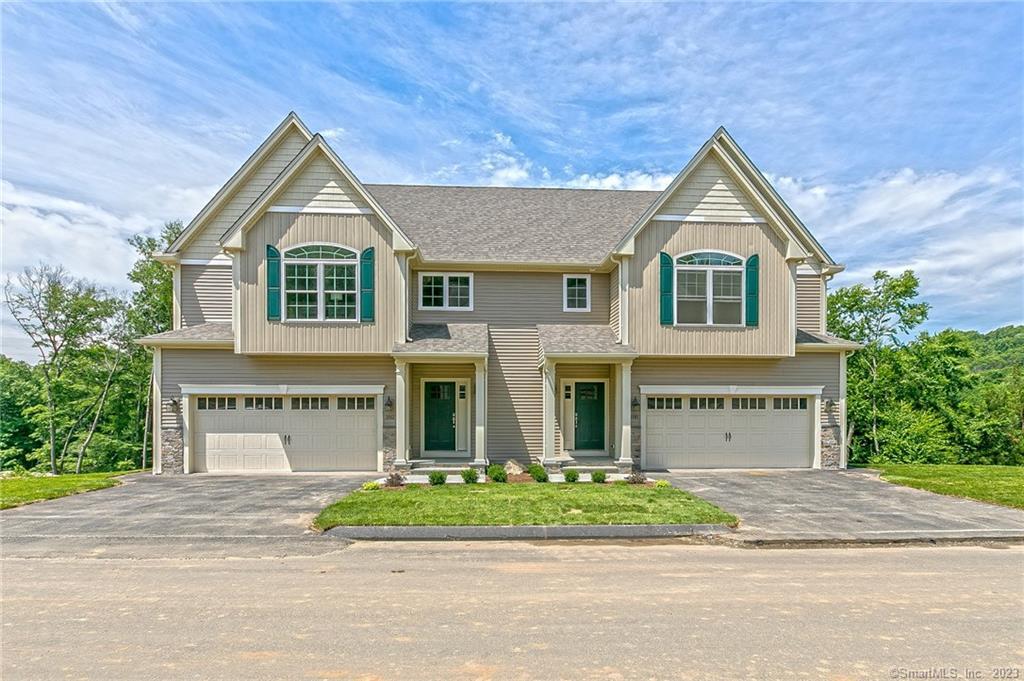 156 Wells View Road Shelton, CT 06484 - Photo 1 of 1 a front view of a house with a yard