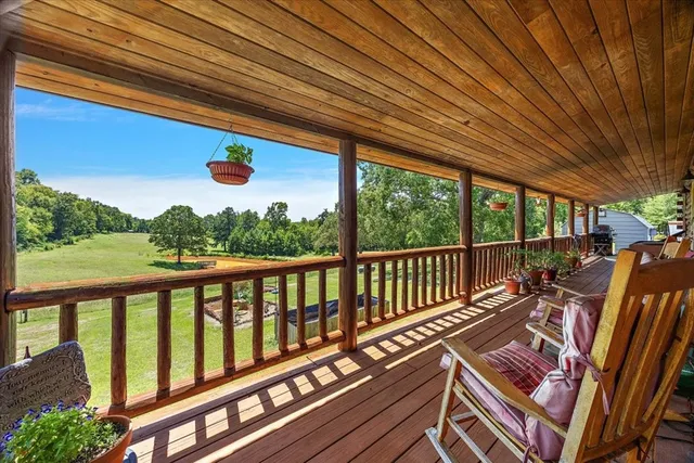 a view of balcony with wooden floor and outdoor space