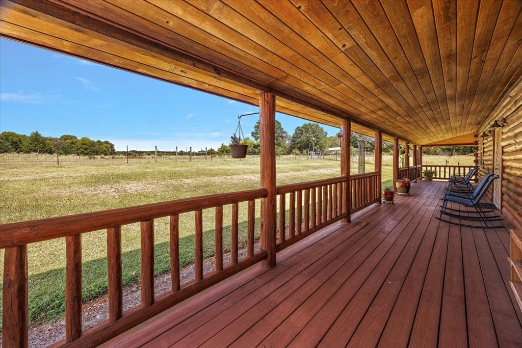 2000 County Road 852 Cushing, TX 75760 - Photo 12 of 50 a view of balcony with wooden floor and outdoor space