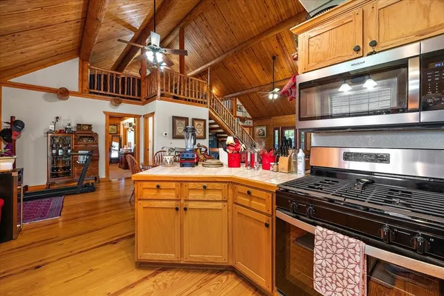 a kitchen with stainless steel appliances granite countertop lots of counter top space