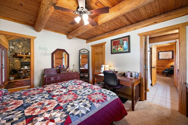 a bedroom with a bed and wooden cabinets