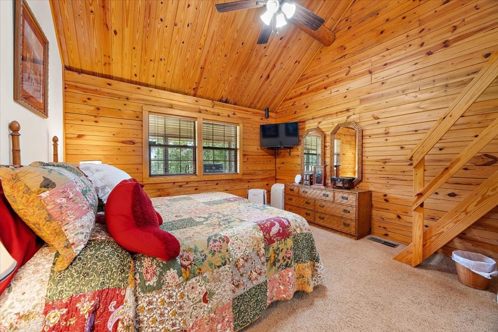 2000 County Road 852 Cushing, TX 75760 - Photo 26 of 50 a bed room with a bed and a chair