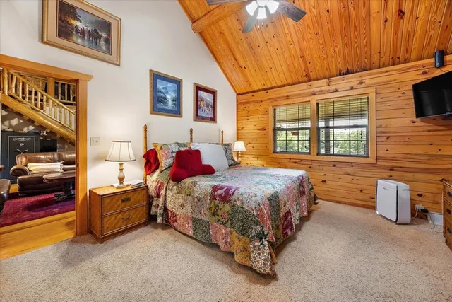 a bed room with a bed and a chair