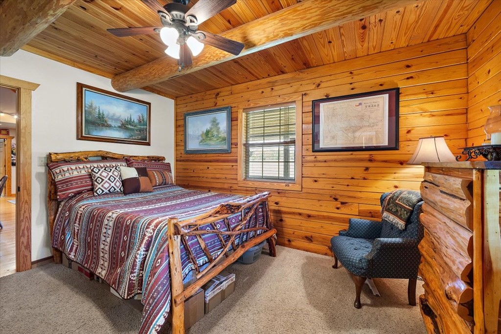 2000 County Road 852 Cushing, TX 75760 - Photo 32 of 50 a bedroom with a bed and ceiling fan