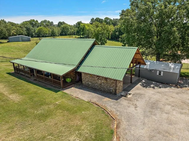 a view of a tennis ground with a small swimming pool