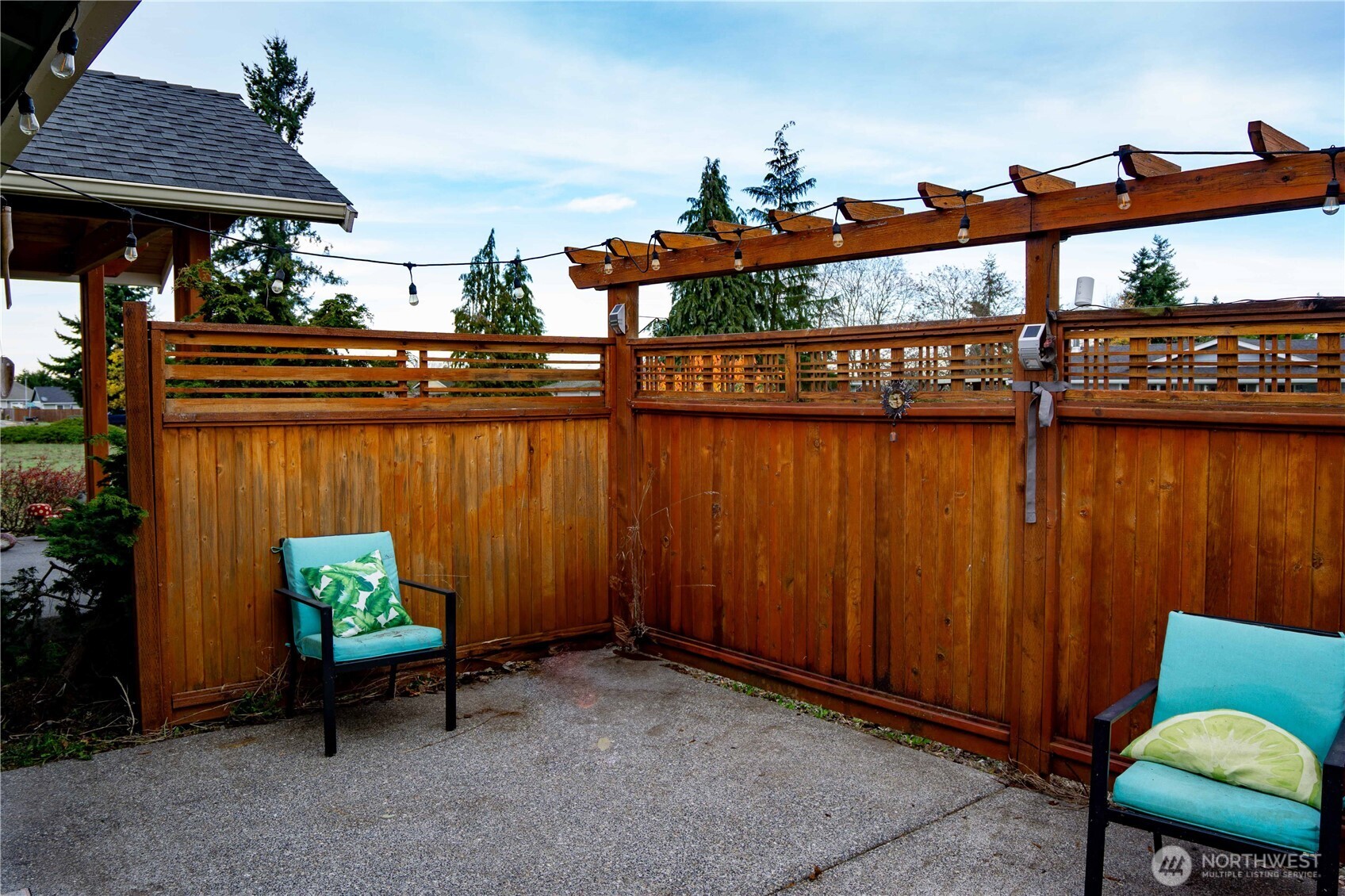 151 Valley View Drive Sequim, WA 98382 - Photo 20 of 40 a backyard of a house with sofas table and chairs