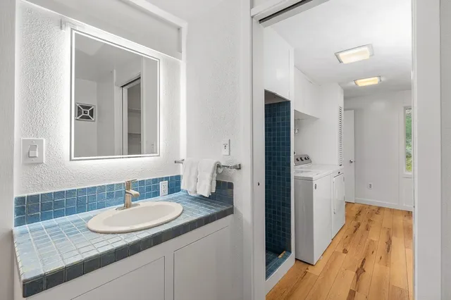 a bathroom with a sink and a mirror