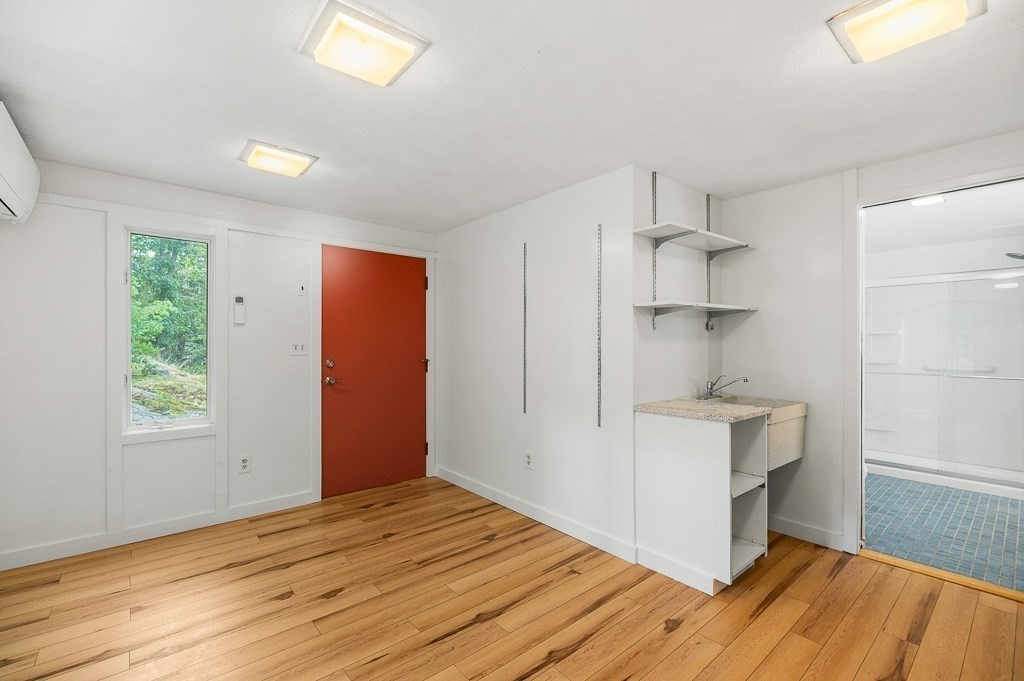 2 Moses Hill Road Manchester, MA 01944 - Photo 13 of 30 a view of empty room with wooden floor and fan
