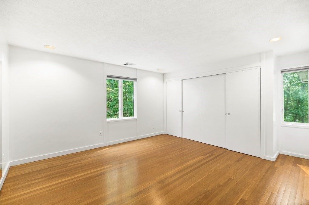 2 Moses Hill Road Manchester, MA 01944 - Photo 21 of 30 a view of empty room with wooden floor and fan
