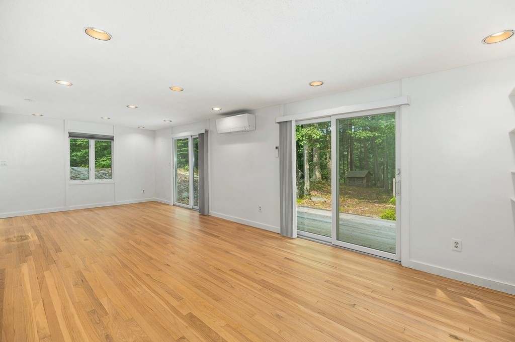 2 Moses Hill Road Manchester, MA 01944 - Photo 4 of 30 a view of an empty room with wooden floor and a window