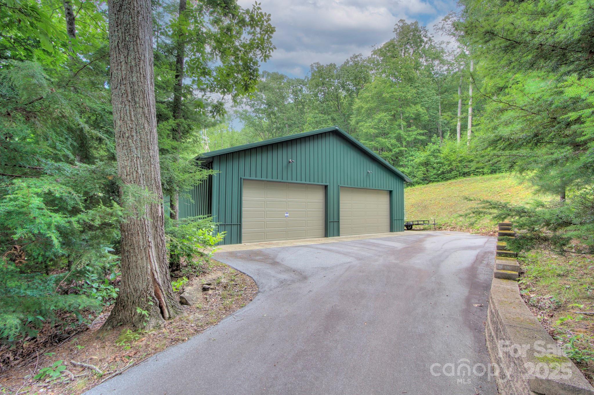 193 Duncan Creek Road Fletcher, NC 28732 - Photo 12 of 48 front view of a house with a garden