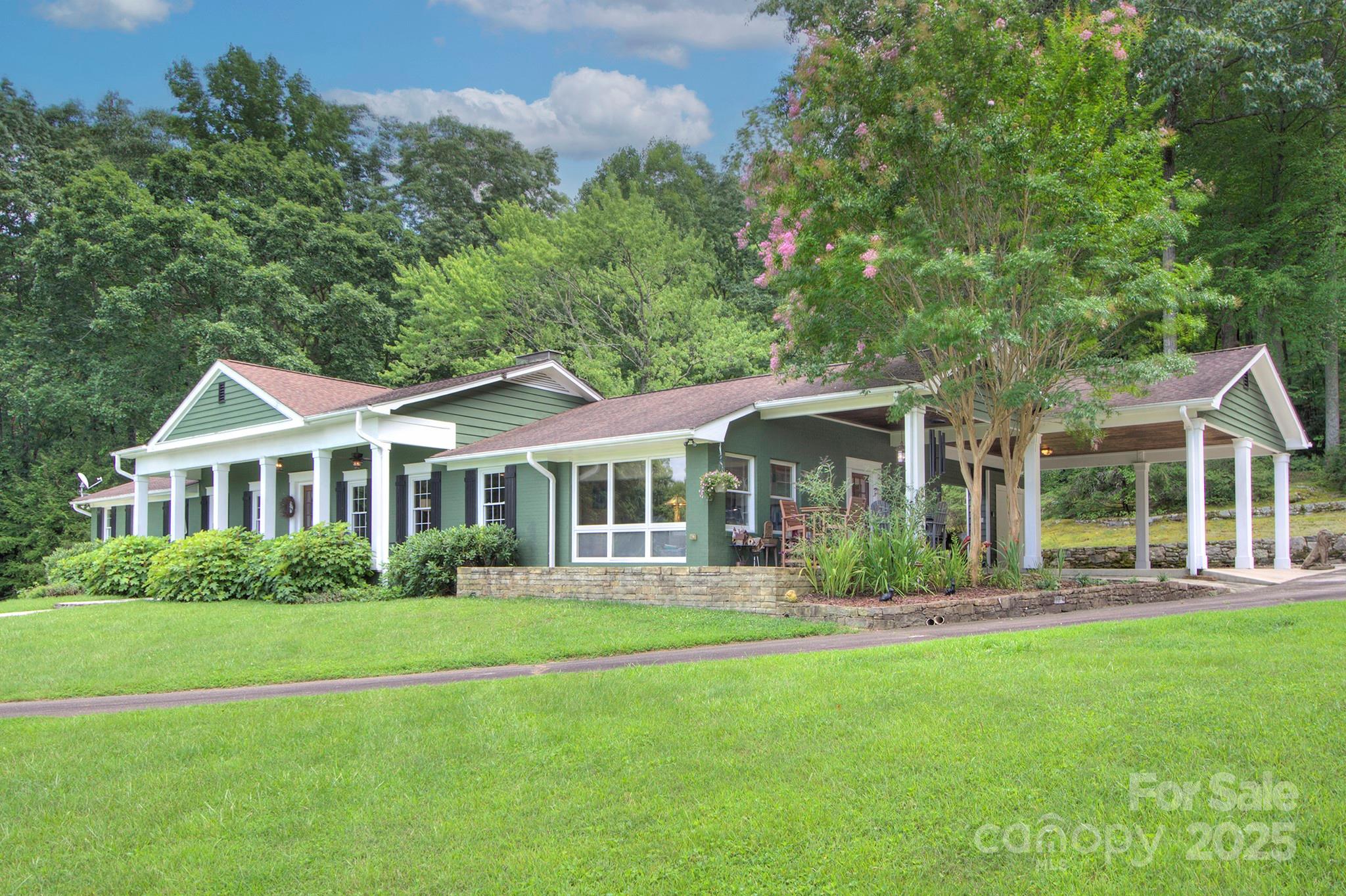 193 Duncan Creek Road Fletcher, NC 28732 - Photo 14 of 48 a front view of a house with a garden
