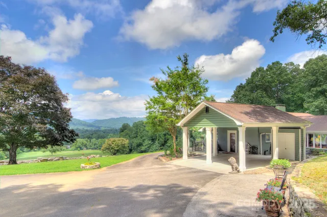 a view of house with yard and entertaining space