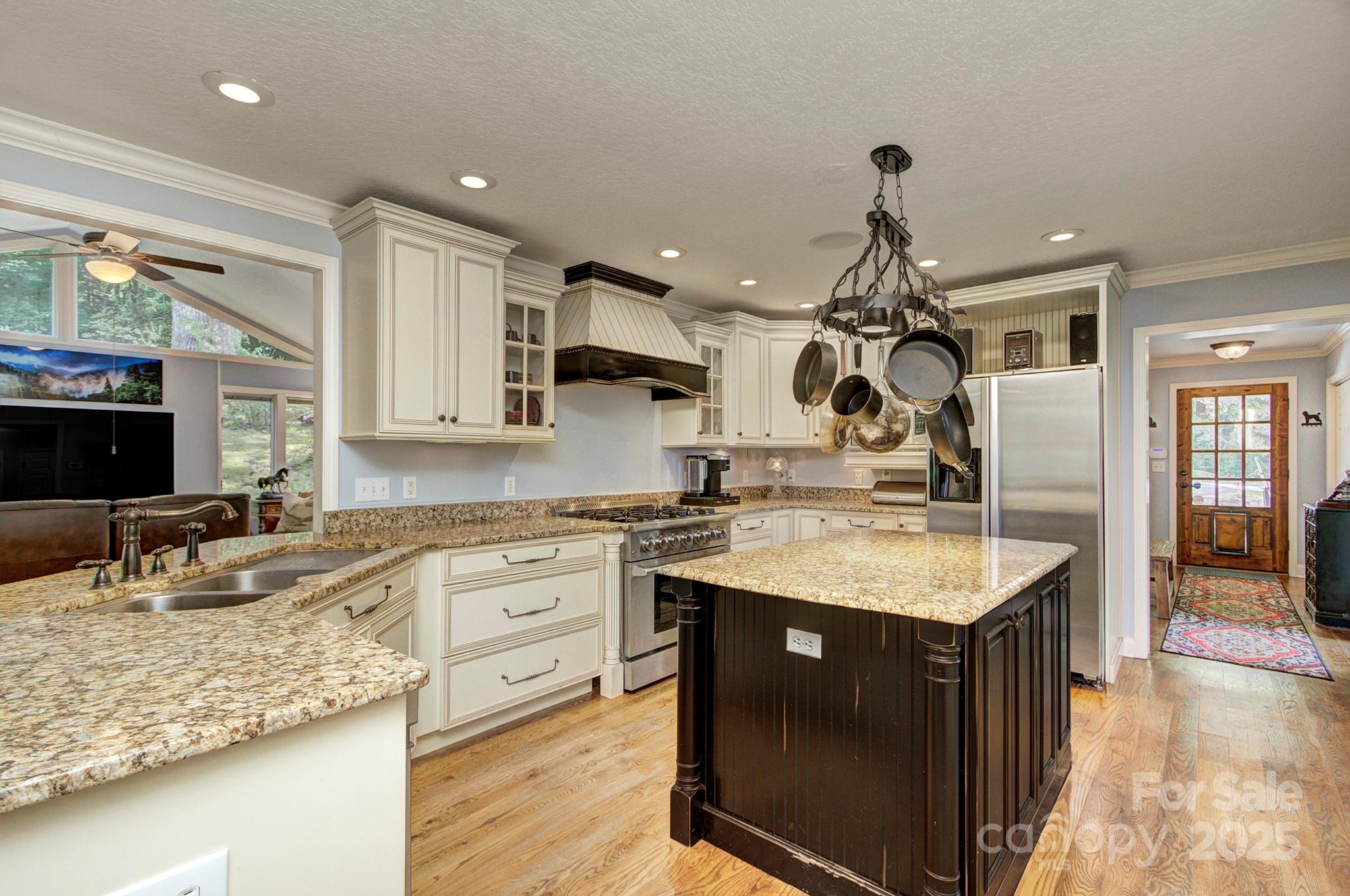 193 Duncan Creek Road Fletcher, NC 28732 - Photo 22 of 48 a kitchen with a sink stove and cabinets