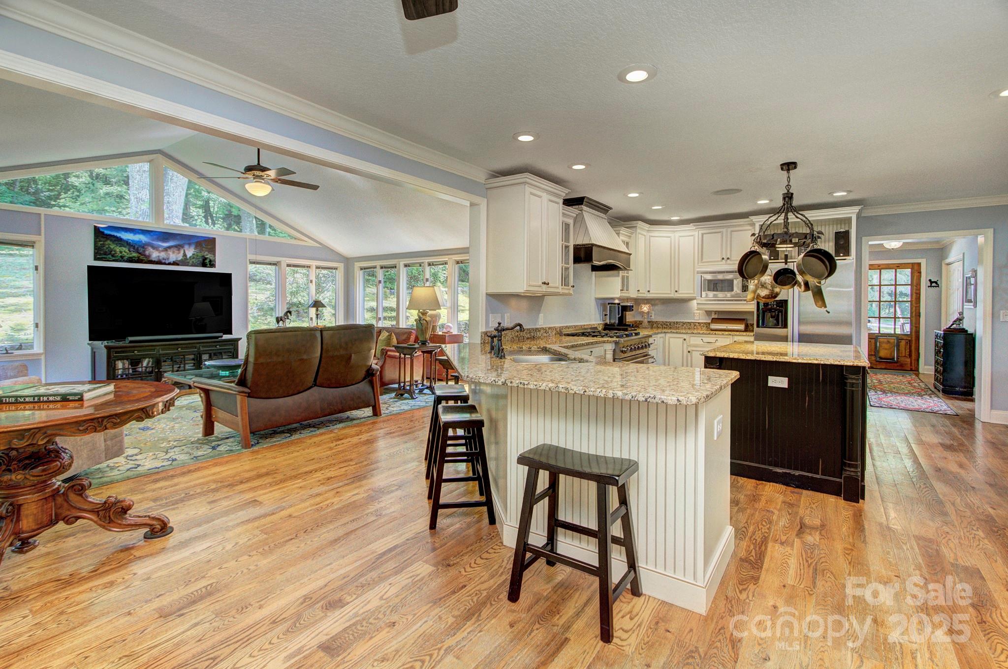 193 Duncan Creek Road Fletcher, NC 28732 - Photo 26 of 48 a living room with stainless steel appliances furniture and a flat screen tv