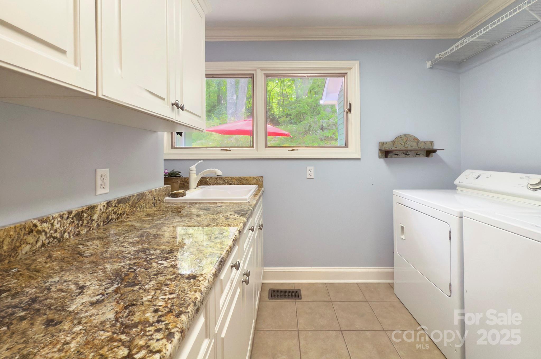 193 Duncan Creek Road Fletcher, NC 28732 - Photo 38 of 48 a bathroom with a sink and a vanity