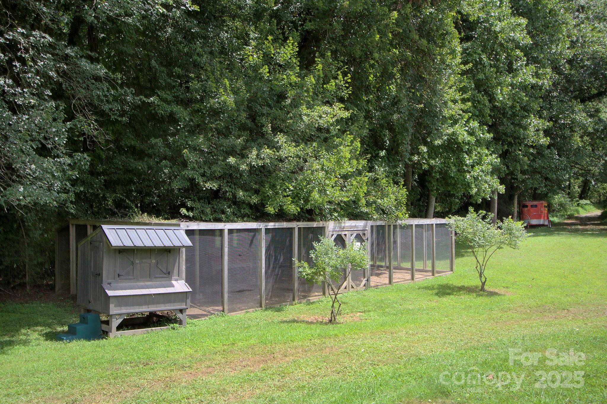 193 Duncan Creek Road Fletcher, NC 28732 - Photo 39 of 48 a view of a backyard with a slide