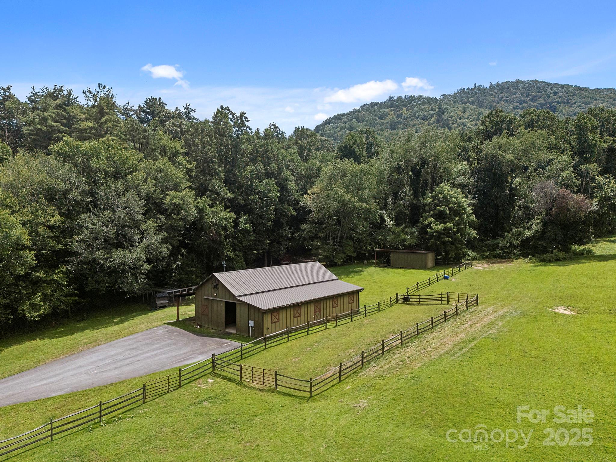 193 Duncan Creek Road Fletcher, NC 28732 - Photo 4 of 48 a view of a swimming pool with a yard