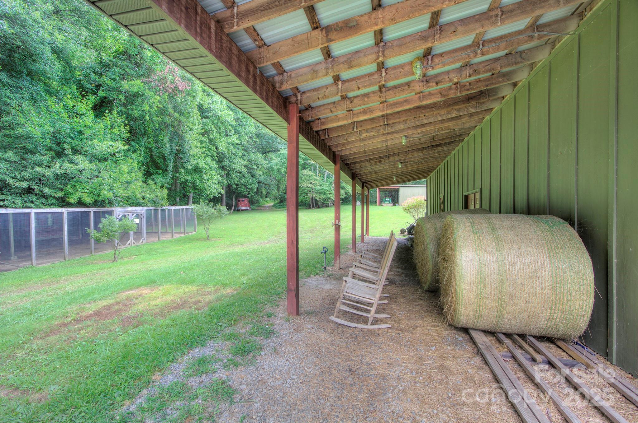 193 Duncan Creek Road Fletcher, NC 28732 - Photo 42 of 48 a view of a porch with a backyard