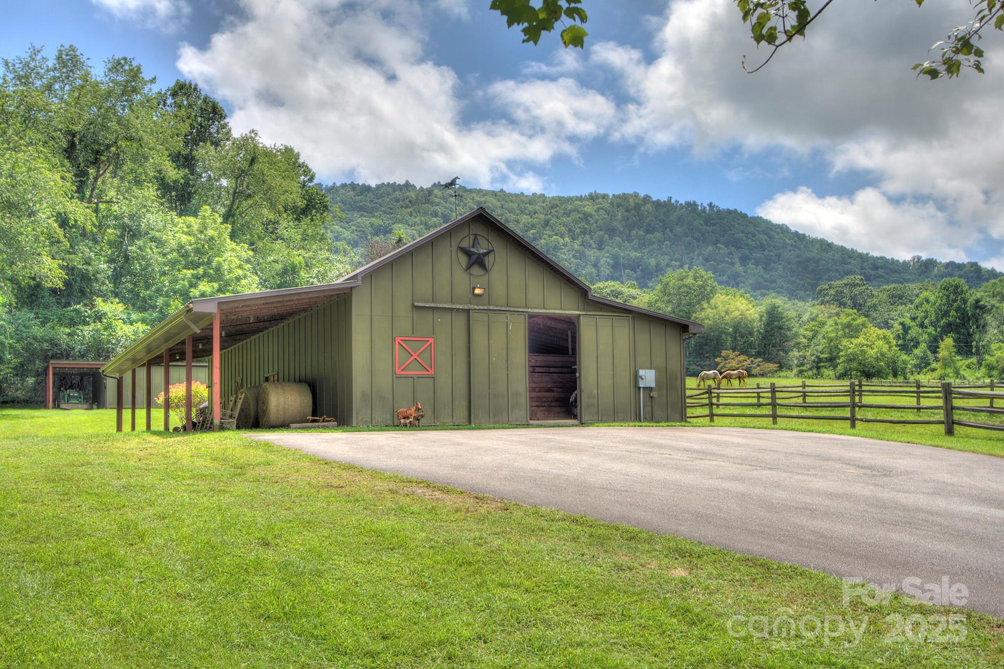 193 Duncan Creek Road Fletcher, NC 28732 - Photo 5 of 48 a front view of a house with a yard and trees