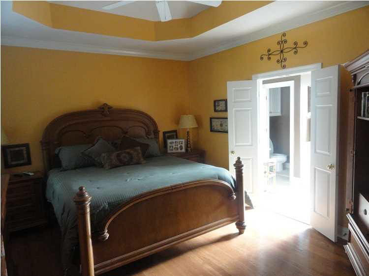 large master with hardwood floors