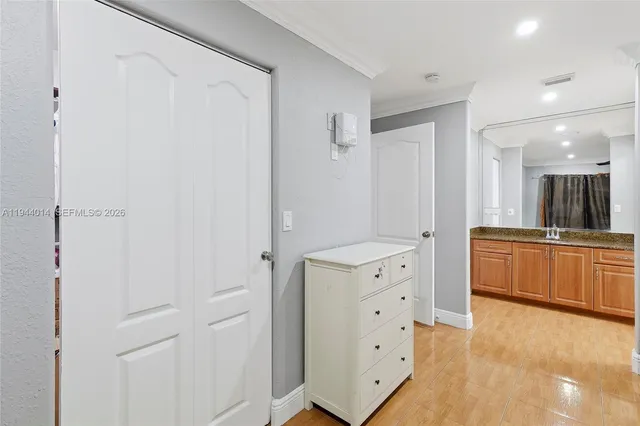 a large bathroom with a sink a large mirror and a shower