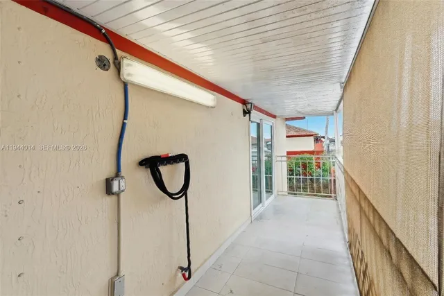 a view of a car park in front of house