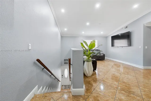 a vase of flowers sitting on a floor