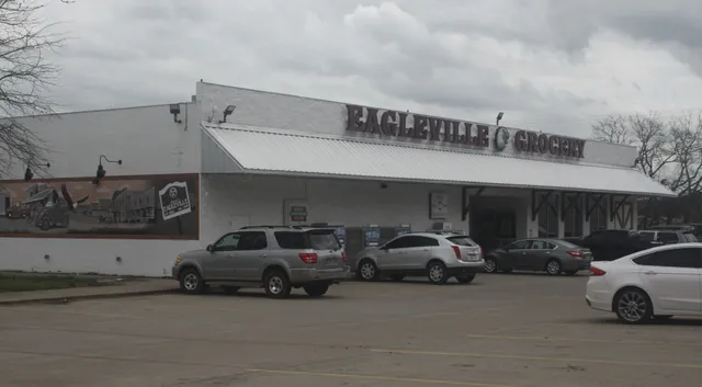 a view of a car parked front of a building