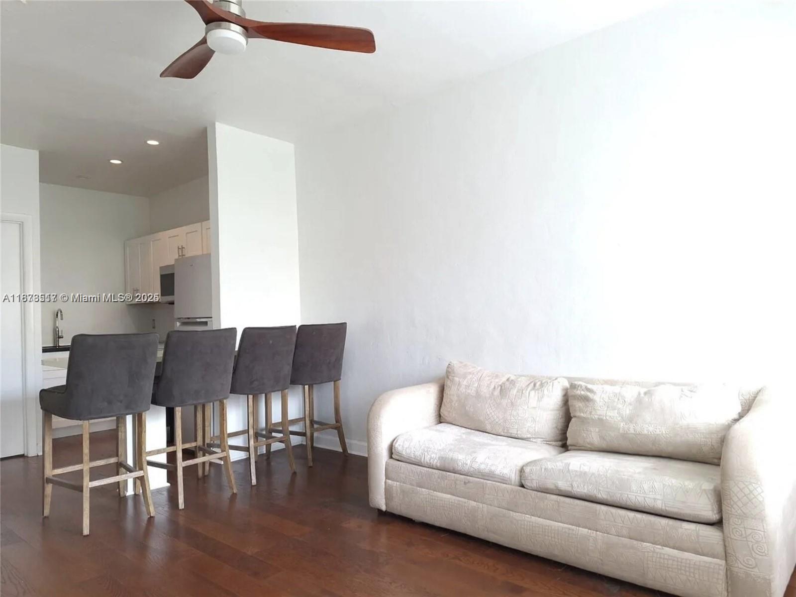 1009 Meridian Avenue, Unit 13 Miami Beach, FL 33139 - Photo 11 of 17 a living room with furniture and kitchen view
