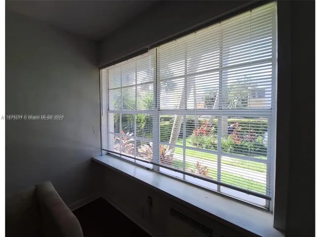 a view of a room with a large window