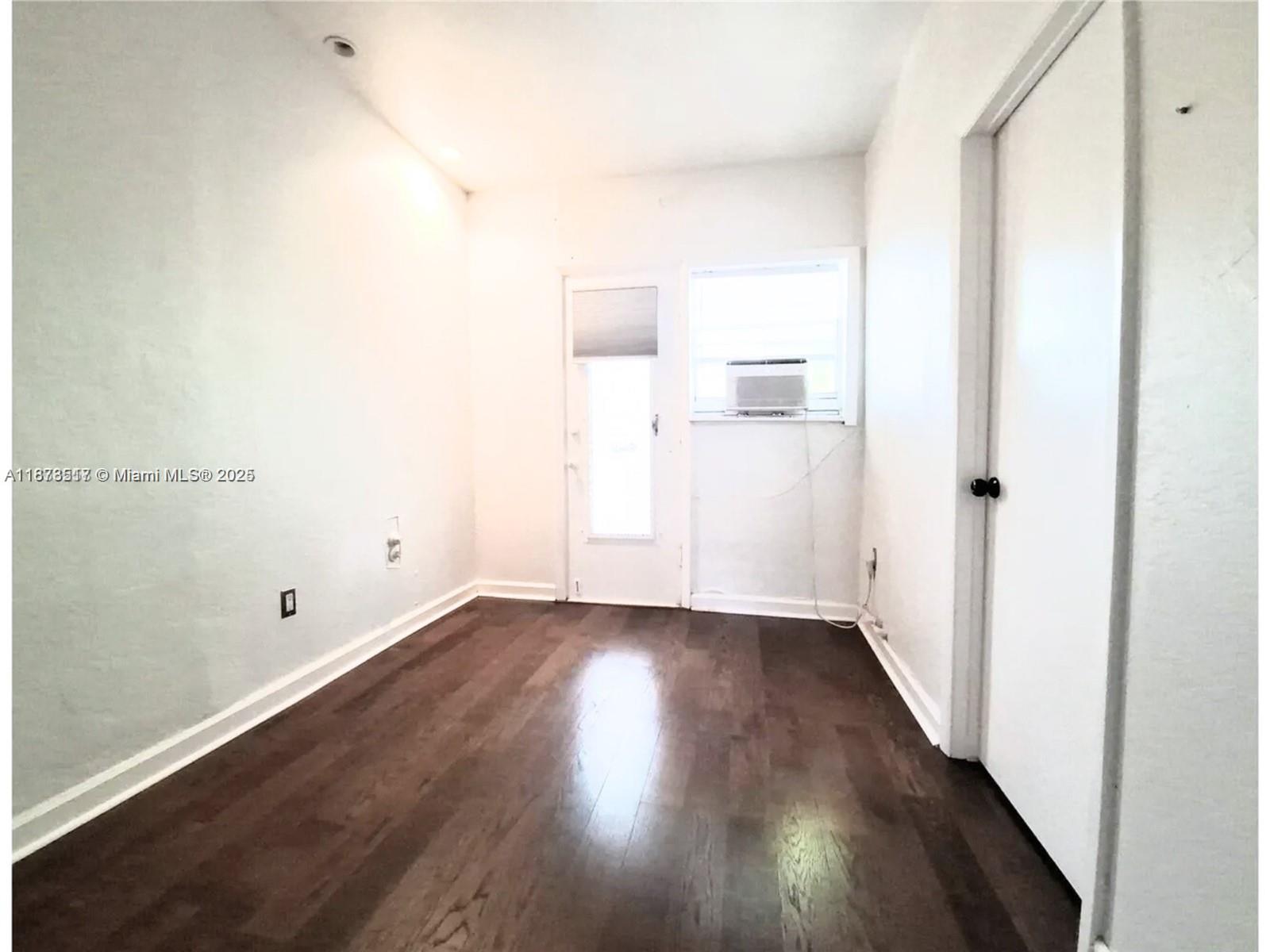 1009 Meridian Avenue, Unit 13 Miami Beach, FL 33139 - Photo 14 of 17 a view of a room with wooden floor