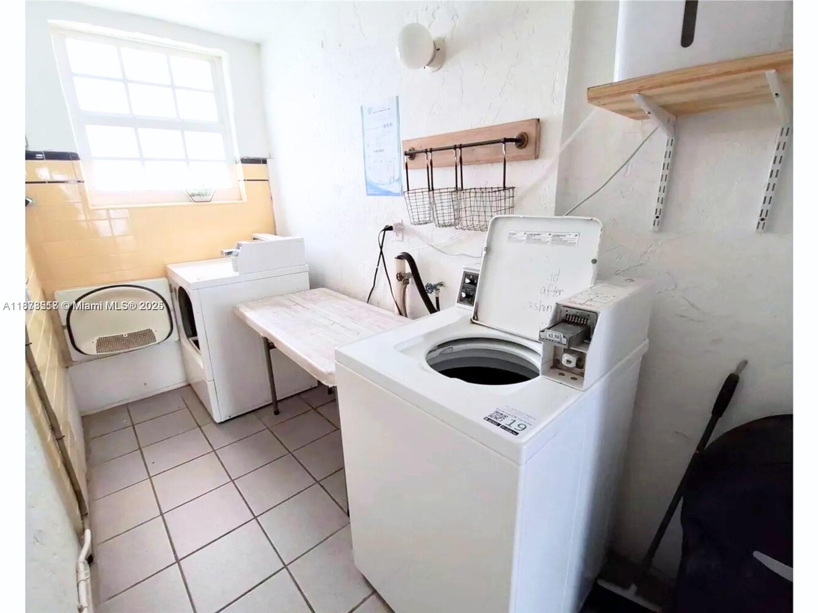 1009 Meridian Avenue, Unit 13 Miami Beach, FL 33139 - Photo 17 of 17 a utility room with dryer and washer