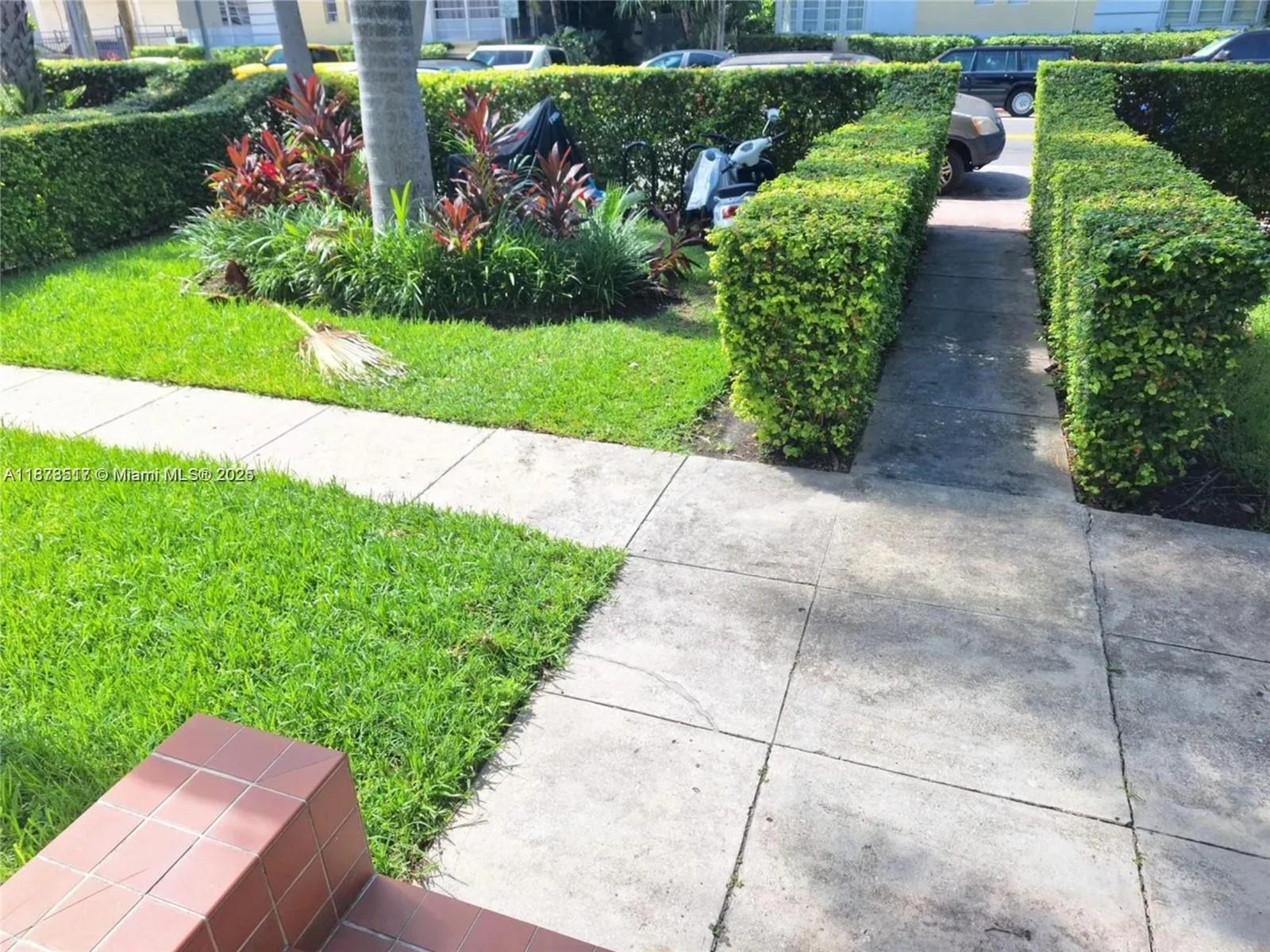 1009 Meridian Avenue, Unit 13 Miami Beach, FL 33139 - Photo 3 of 17 a view of a garden with flowers