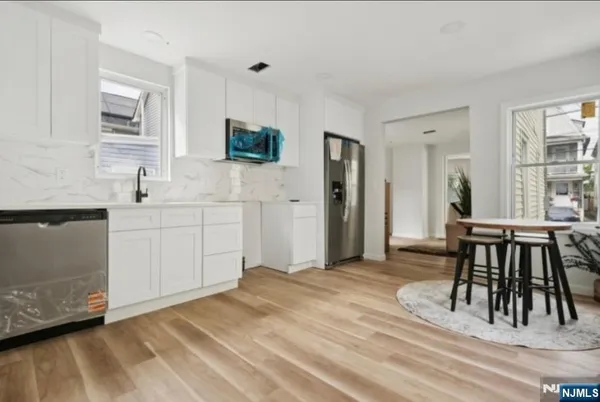 a spacious bedroom with a bed and a table