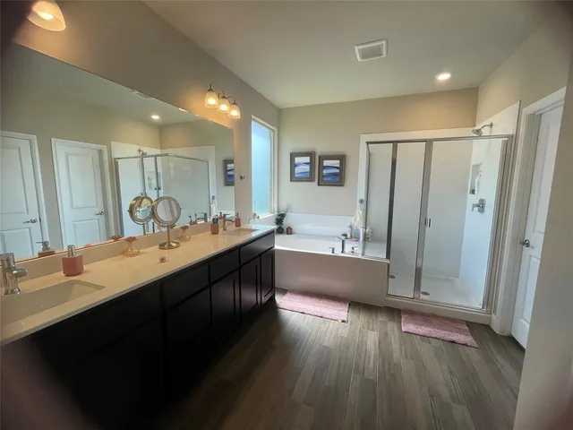 a view of a house with a yard and sitting area