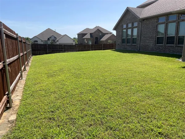 a bathroom with a double vanity sink a large mirror and shower