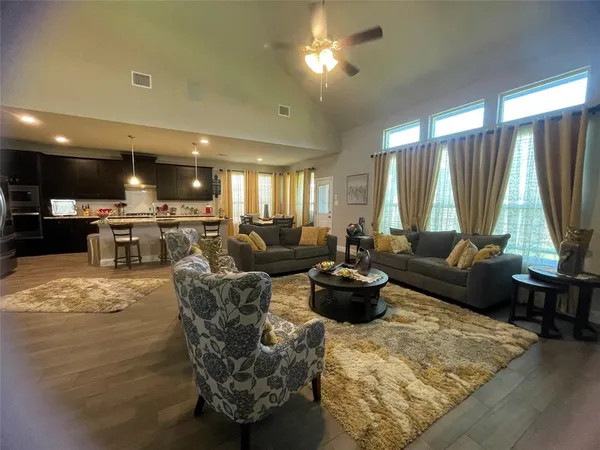 a living room with furniture and a large window