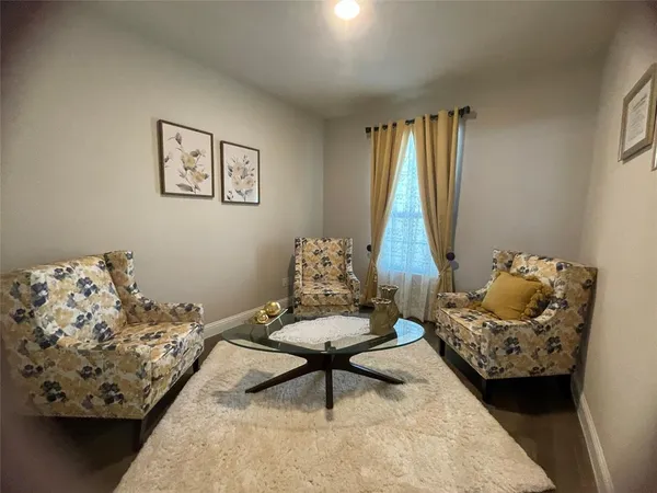 a living room with furniture and a window