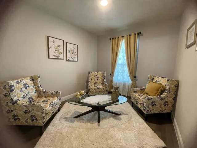 a living room with furniture and a window