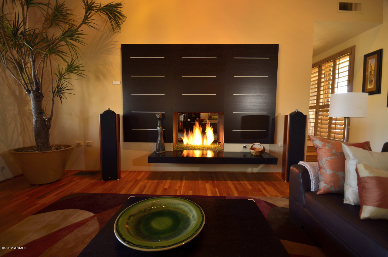 36410 North Long Rifle Road Carefree, AZ 85377 - Photo 10 of 40 2-way fireplace from the Family Rm side