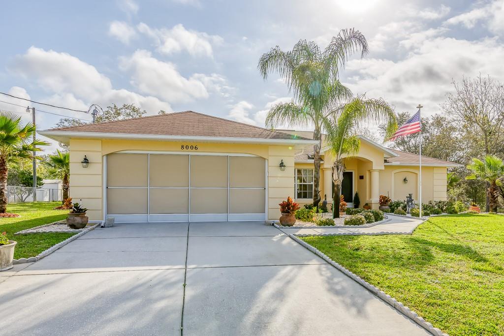 8006 Nightwalker Road Weeki Wachee, FL 34613 - Photo 1 of 1 a view of a white building with a fountain in front of it
