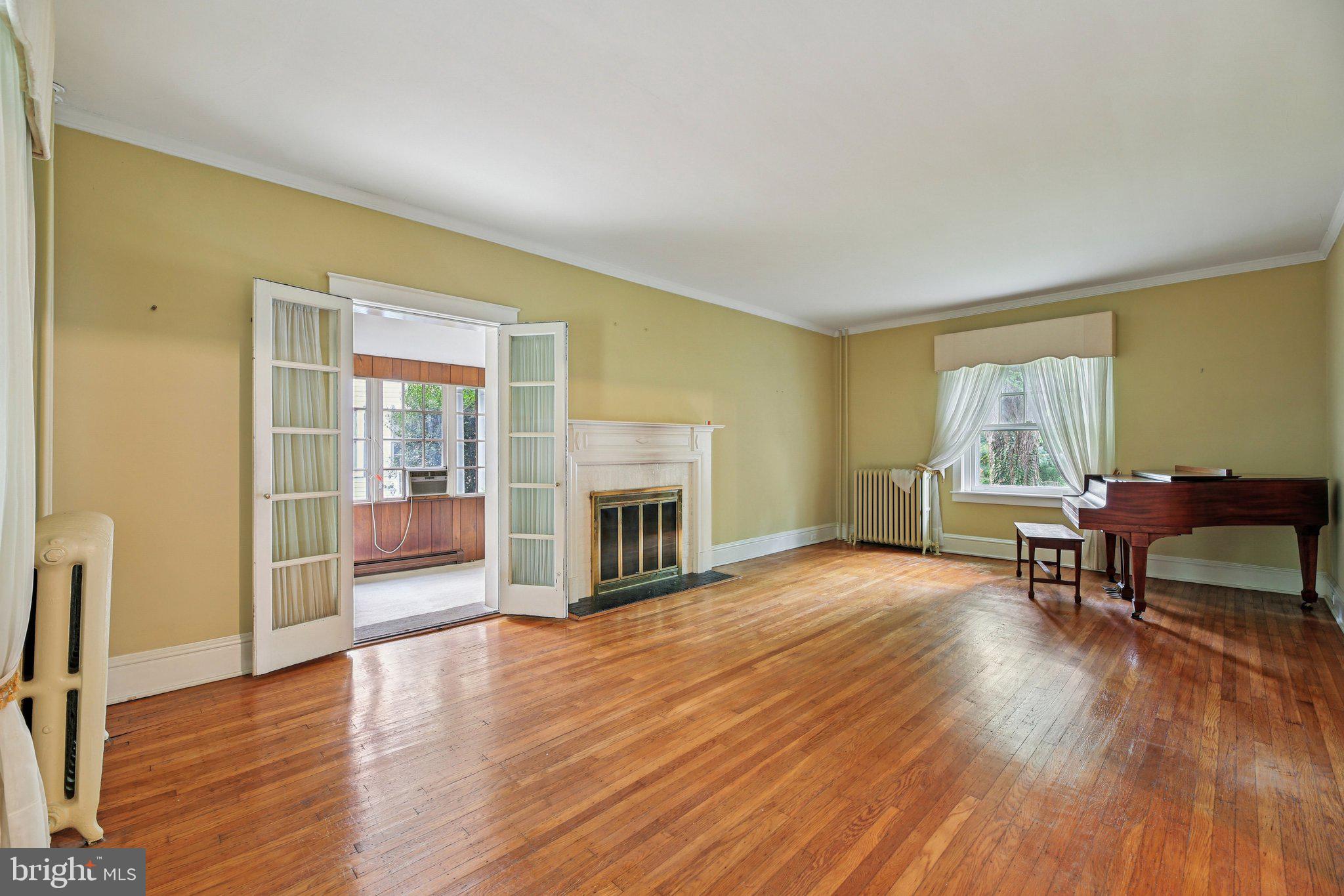 409 Cedarcroft Road Baltimore, MD 21212 - Photo 6 of 43 a living room with furniture and a fireplace