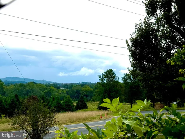 a view of a backyard with a barn