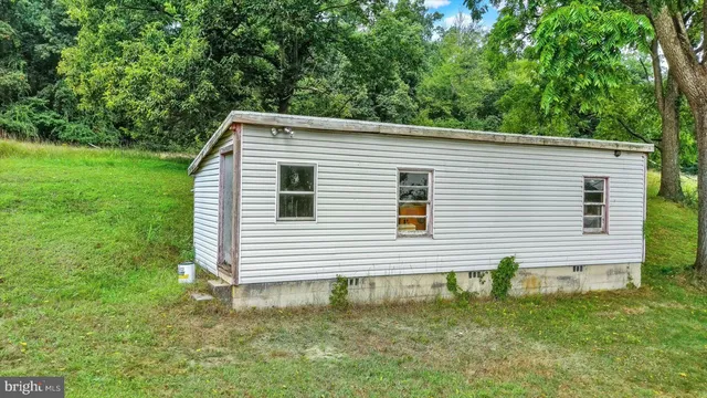 a kitchen that has a sink and a stove in it