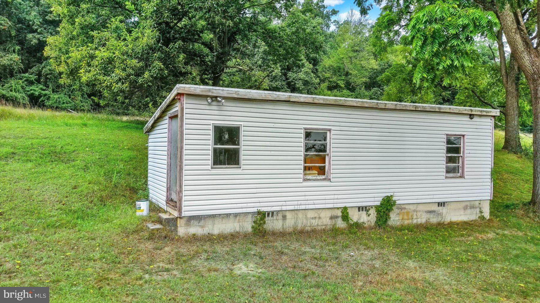 235 Camp Ground Road Dillsburg, PA 17019 - Photo 28 of 61 a front view of a house with a garden