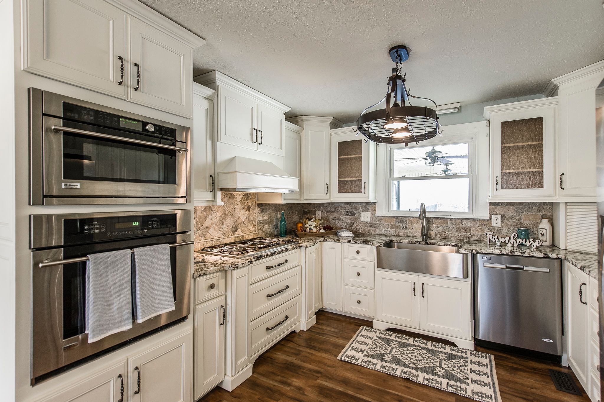 1881 Pinnacle Road Pleasant View, TN 37146 - Photo 15 of 62 a kitchen with stainless steel appliances granite countertop a stove sink and cabinets
