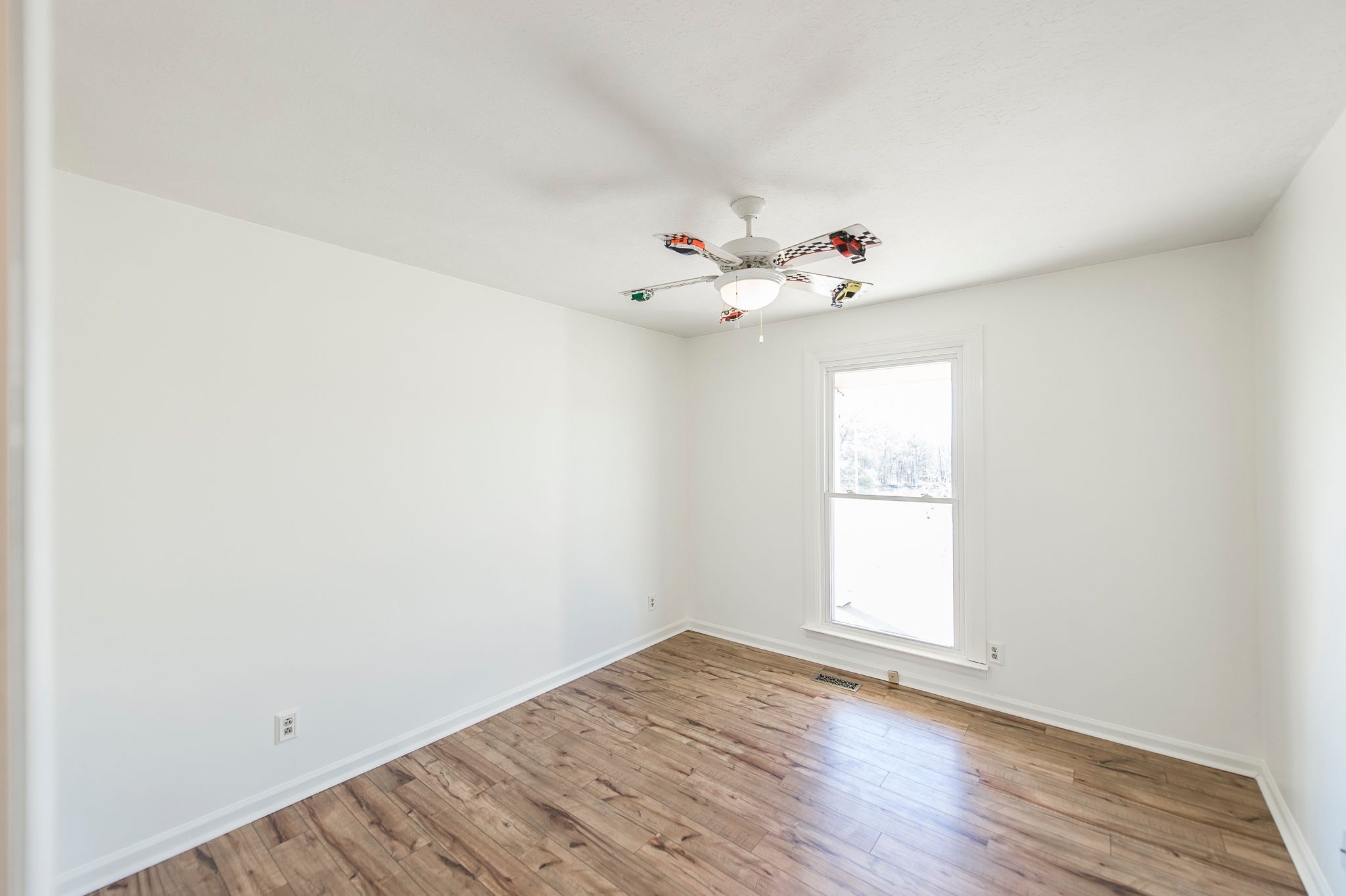 1881 Pinnacle Road Pleasant View, TN 37146 - Photo 20 of 62 an empty room with wooden floor and window